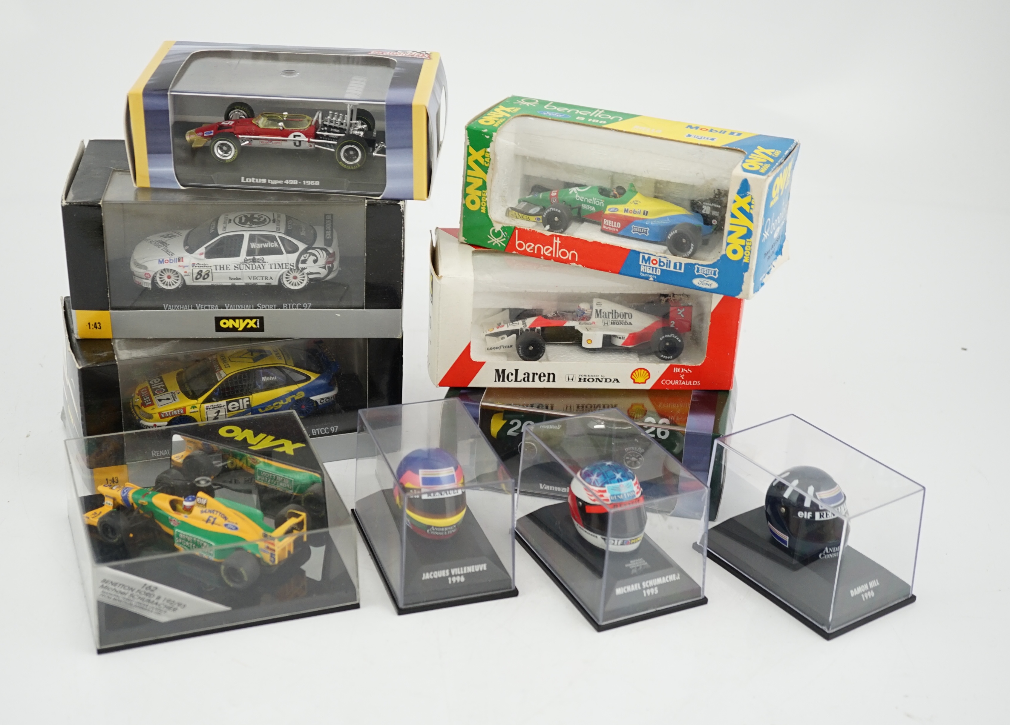 Thirty-seven boxed diecast motor racing related models by Onyx, Atlas Editions, etc. including 1:43 scale Formula One racing cars, models of helmets of famous drivers, etc.